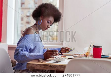 Interior Designer Holding Painting Brush Making Sketches For New Project