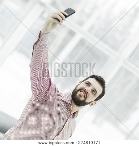 Businessman Makes Selfie While Standing Near Window In Office