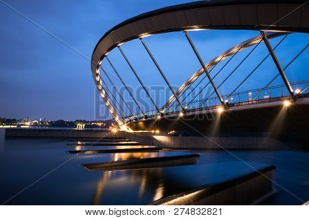 Curvy Bridge With The Water Gate At The Bottom. Water Are Flowing.