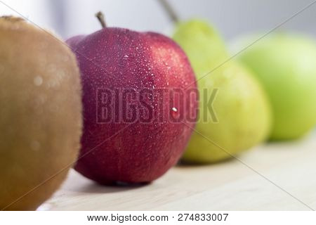 Green And Red Apple, Pear And Kiwi Fruits. Selective Focus.