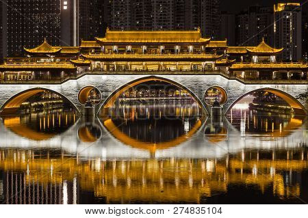 Chengdu Anshun Bridge At Night Reflecting In The Jinjiang River Dark And Gold Colors In Sichuan Prov