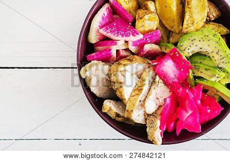 Buddha Bowl Dish With Chicken Fillet, Beked Potato, Avocado, Cabbage, Watermelon Radish And Chia See