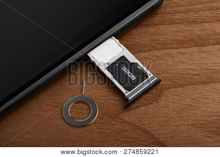 Sim Card And Microsd Card Tray With Removal Tool At The Side Of Smartphone