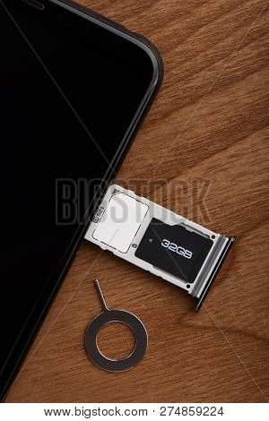 Sim Card And Microsd Card Tray With Removal Tool At The Side Of Smartphone