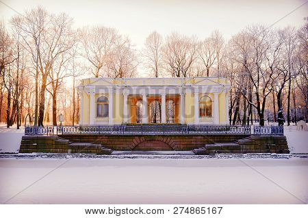 Granite Pier And Pavilion On The Bank Of The Moika River In The Mikhailovsky Garden In Winter. Saint