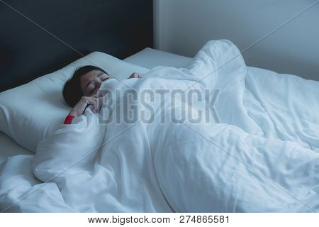 Woman With Scare And Panic While Lying Down Under The Blanket In Bedroom,nightmare Or Bad Dream