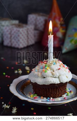 Chocolate Cupcake With Vanilla Cream And Candle. Happy Birthday. Dark Photo