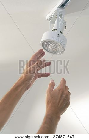 Electric Male Hand Lamps With Ceiling Led Lamp, Spotlight. The Concept Of Repair And Maintenance.