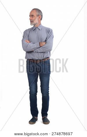 Middle-aged Man With Blue Jeans And Shirt  Crossed Arms On White Background