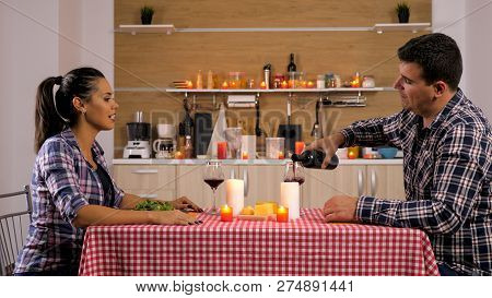 Sweet Couple Having A Romantic Dinner At Home