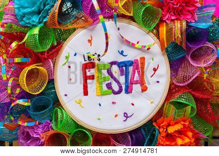 The Word `fiesta` Stitched In Colorful Letters On Multicolored Mash Decorated With Ribbons, Glitter 