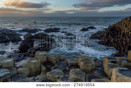 Giant's Causeway, North Ireland, Uk During Winters. The Fierce Waves Batter The Iconic Coastline Of 