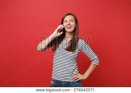 Attractive Young Woman In Striped Clothes Talking On Mobile Phon