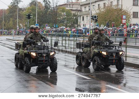 European Street, Prague-october 28, 2018: Soldiers Of Czech Army Are Riding Atv Gladiator X8 On Mili