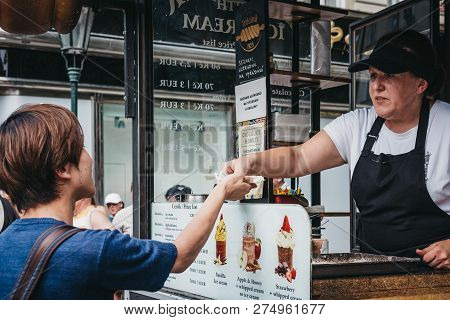 Prague, Czech Republic - August 23, 2018: Tourists Buying Trdelnik, A Sweet Pastry That Is Popular A