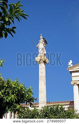 Statue Of Athena Placed Behind The Statue Of Plato In Athens, Greece