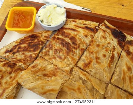 Turkish Tahini Katmer With Honey And Cream / Tahinli Katmer. Traditional Food.