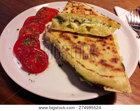 Turkish Bazlama Tost / Toast Sandwich With Pesto Sauce And Cherry Tomatoes. Fastfood.