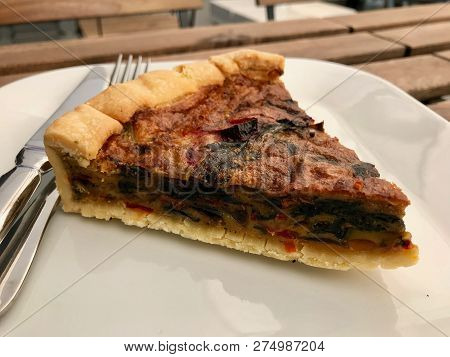 Turkish Food Quiche Tart Kis / Vegetable Pie Slice Served With Plate At Restaurant.