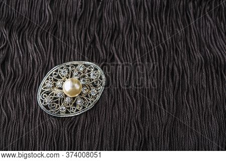 Vintage Pearl Jewelry Brooch On Little Black Dress. Gatsby Or Chicago Fashion Look. Getting Ready Fo