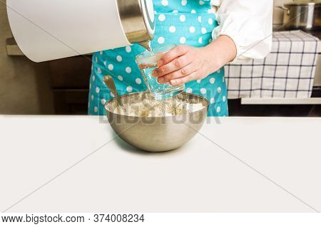 Cooking Dough For Baking In Home Kitchen. Female Hands Pour Boiling Water Into A Glass. Homemade Foo