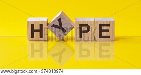 Hype - Wooden Blocks With Letters, Hype Concept, Front View On Yellow Background