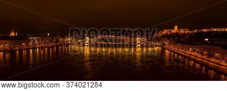 Panoramic Aerial Drone Shot Of Chain Bridge Over Danube River In Budapest Evening