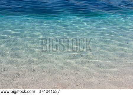 Sea Water Near Beach Natural Background , White Stone Pebble Beach In Croatia Sumartin Brac Island P