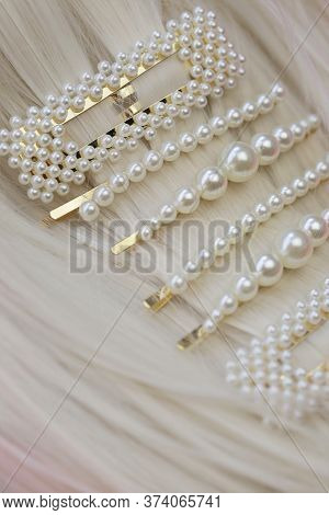Pearl Hair Accessories. Hair Clips On Blond Hair . Fashionable Hair Accessories. Hairpin With Pearls