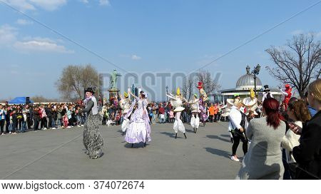Odessa, Ukraine - 04 01 2019: Clown With Doll Princesses Perform On Jumpers In Front Of A Crowd Of P