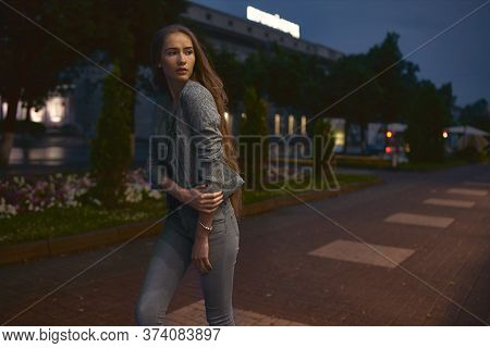 Girl In Grey Suit Posing Beside Buildings
