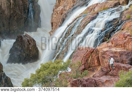 Epupa, Namibia - May 26, 2011: Part Of The Epupa Waterfalls In The Kunene River. People Are Visible
