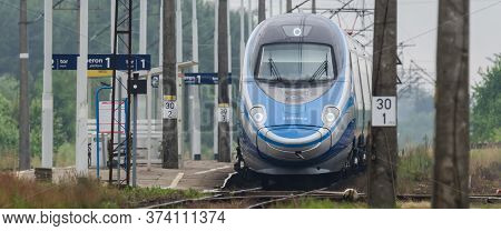 Ustronie Morskie, West Pomeranian / Poland - 2020: The Express Train Goes Through A Small Station On