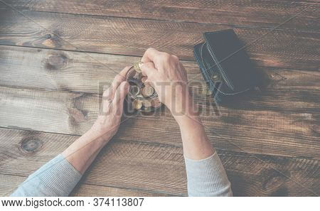 Old Wrinkled Hands On Walking Frame. Hands Of A Standing Senior Woman Leaning On A Rollator. Pension