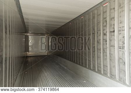 Empty Interior Shipping Cargo Container For Transportation Shipping And Logistic With Copy Space At 