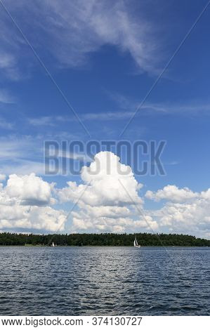 Masuria, Poland - June 24, 2020 : Lake In Polish Masuria, Sailing Yachts On A Sunny Day. Picturesque