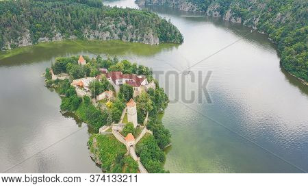 Aerial View On Czech Medieval Castle Zvikov, Situated On Rocky Outcrop Above The Confluence Of Two R