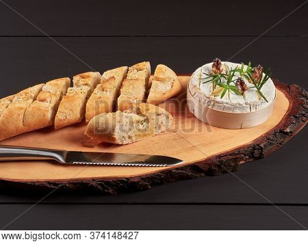 Baked Camembert With Walnuts, Rosemary Stalks And Garlic Cloves, Served With Crusty Garlic Gread, On