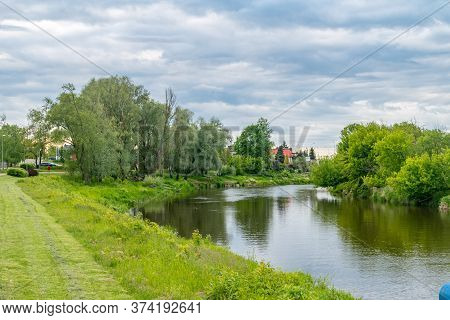 Boulevards On Narew River At Cloudy Day In Lomza.