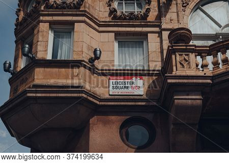 London, Uk - June 13, 2020: Street Name Sign On A Brick Wall Of A Building In Leicester Square In Th