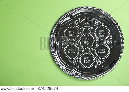 Passover Seder Plate (keara) On Light Green Background, Top View With Space For Text. Pesah Celebrat
