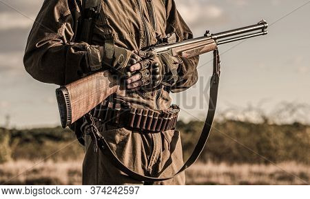 Hunter Man. Hunting Period, Autumn Season. Male With A Gun. A Hunter With A Hunting Gun And Hunting 