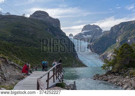 Puerto Natales, Chile February 08, 2020: Visitors At A Viewpoint On The Serrano Glacier, Patagonia, 