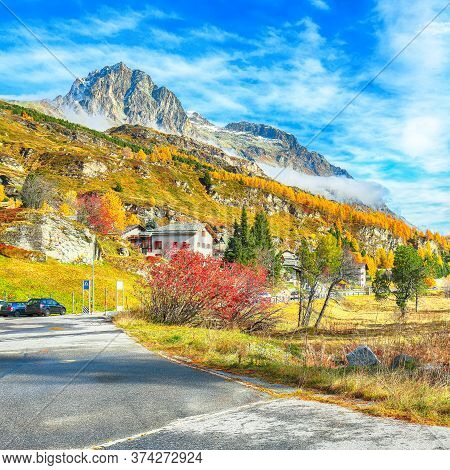 Awesome Autumn Scene Near Maloja Village Overlooking Mount Piz Materdell  . Colorful Autumn Scene Of