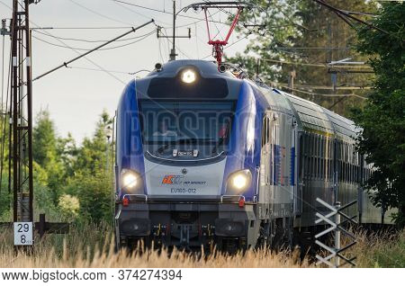 Ustronie Morskie, West Pomeranian / Poland - 2020: A Passenger Express Train Travels On The Rail Rou