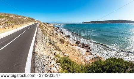 Coastline Road To Prasonisi Beach With Kite Surfers In Background (rhodes, Greece)