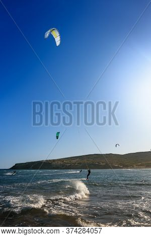 Prasonisi Beach With Kitesurfers Surfing In Waves (rhodes, Greece)