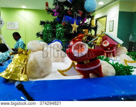 Beautiful View Of Christmas Tree Decoration With Bell, Gift Box And Star. Done At Entrance Of Columb