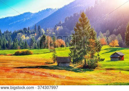 Splendid View Of Alpine Meadow Near Wagenbruchsee (geroldsee) Lake With Wooden Huts And Zugspitze Mo