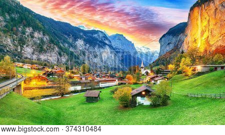 Dramatic Autumn View Of Lauterbrunnen Valley With Gorgeous Staubbach Waterfall And Swiss Alps At Sun